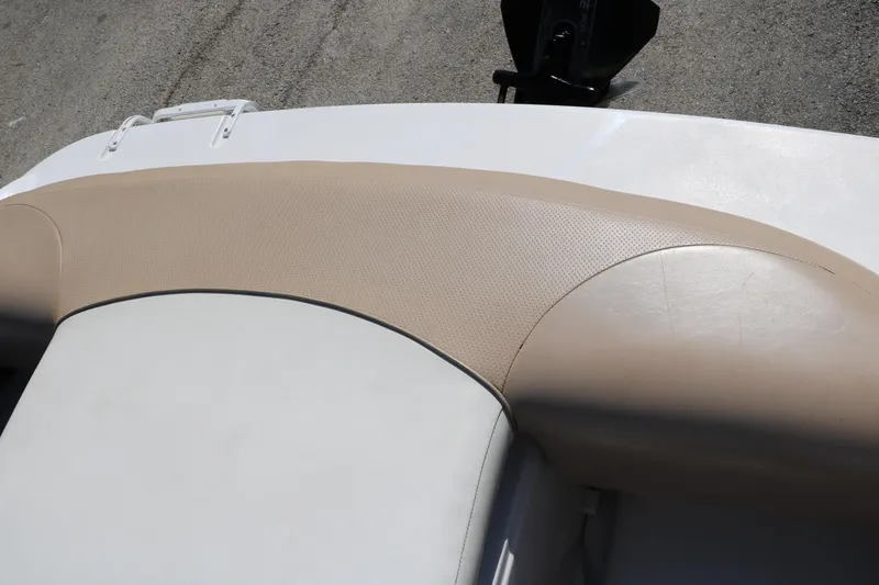 Slide: The Image of 2006 Four Winns 180 Horizon boat interior with beige and white upholstery. - 28