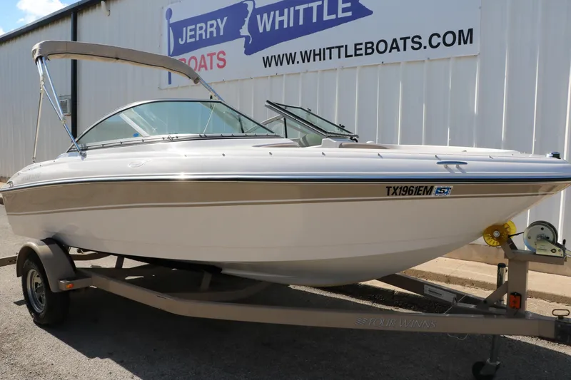 Slide: The Image of 2006 Four Winns 180 Horizon boat on trailer at Jerry Whittle Boats dealership. - 9