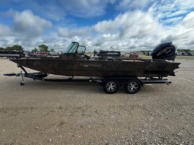 Slide: The Image of 2025 G3 Sportsman 2400 boat on trailer under cloudy sky. - 4