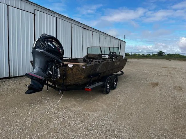 Slide: The Image of 2025 G3 Sportsman 2400 boat with Yamaha outboard motor on trailer, parked outdoors. - 7
