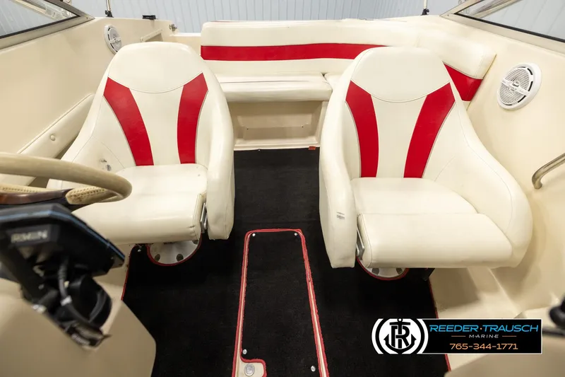 Slide: The Image of 2002 Rinker 192 Captiva boat interior with red and white seating. - 19