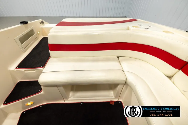 Slide: The Image of 2002 Rinker 192 Captiva boat interior with red and white seating. - 20
