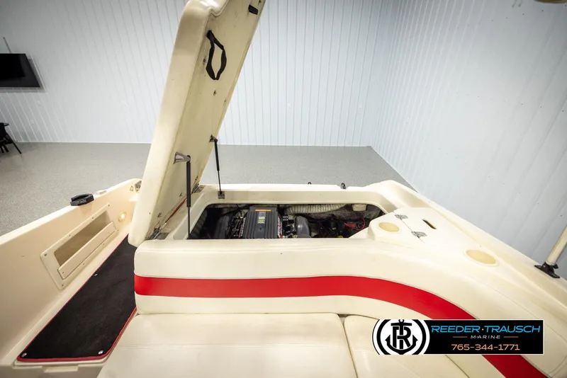 Slide: The Image of 2002 Rinker 192 Captiva boat engine compartment with open hatch, showcasing interior details. - 21