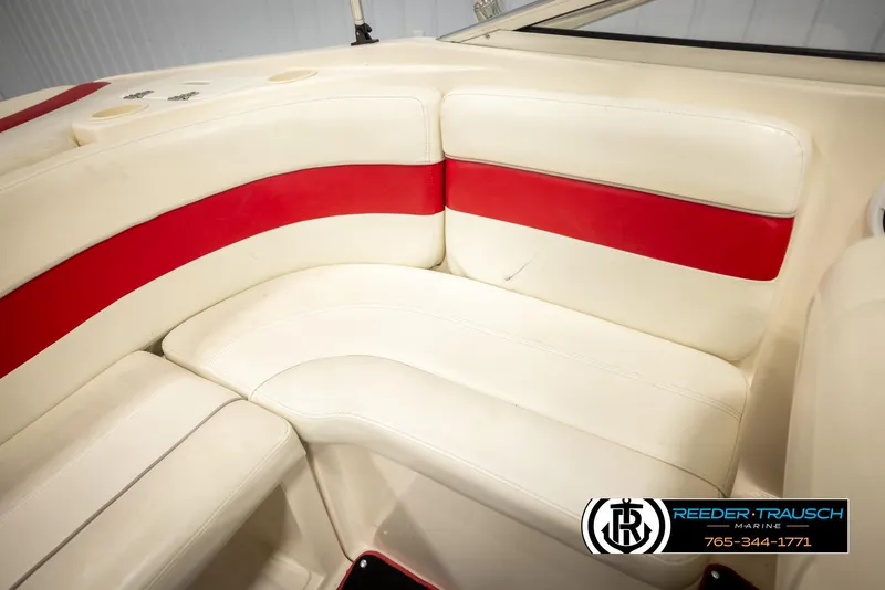 Slide: The Image of 2002 Rinker 192 Captiva boat interior with white and red seating. - 22