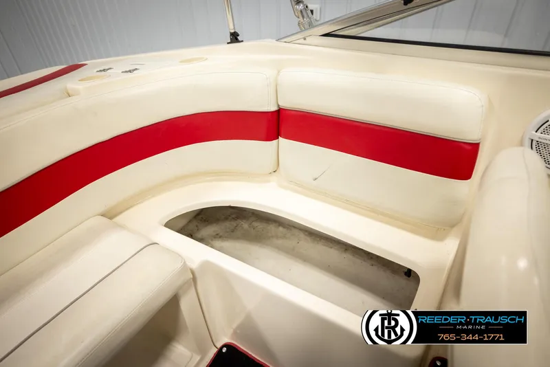 Slide: The Image of 2002 Rinker 192 Captiva boat interior with red and white seating. - 23