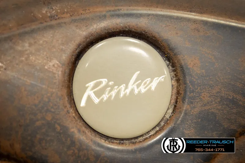 Slide: The Image of Rinker 192 Captiva 2002 emblem on a weathered surface. - 32