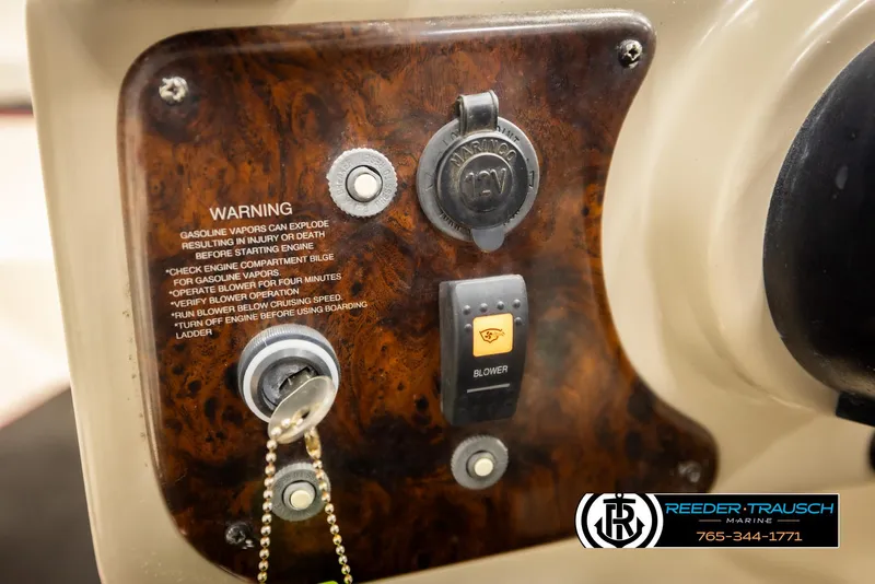 Slide: The Image of Control panel of a 2002 Rinker 192 Captiva boat with ignition and warning labels. - 33