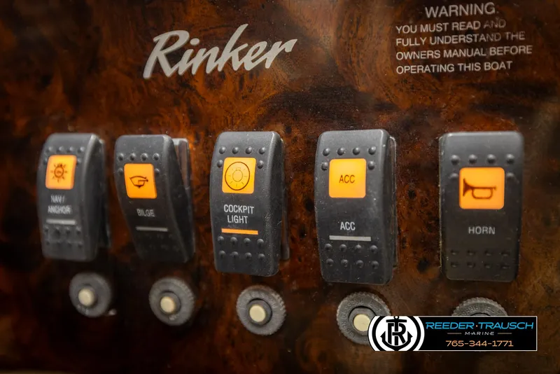 Slide: The Image of Control panel of a 2002 Rinker 192 Captiva boat with labeled switches. - 37