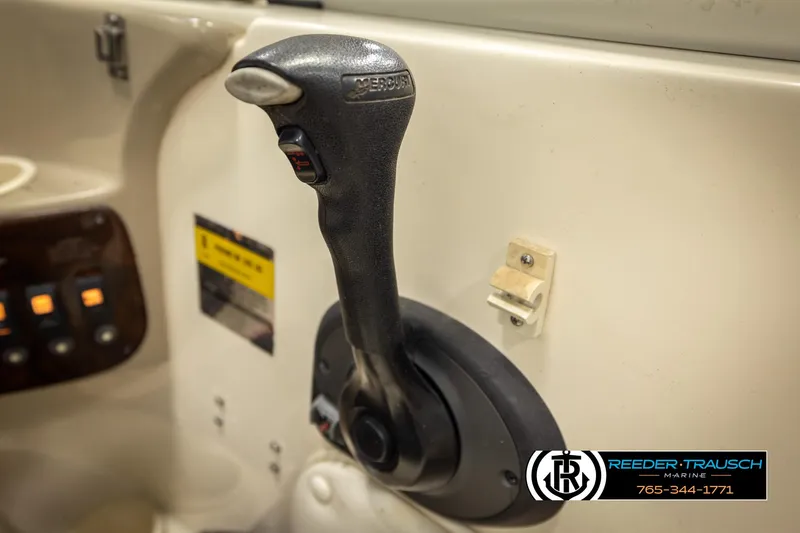 Slide: The Image of Throttle control of a 2002 Rinker 192 Captiva boat, featuring a sleek design. - 38