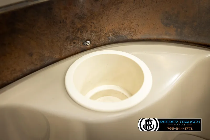 Slide: The Image of Cup holder on a 2002 Rinker 192 Captiva boat interior. - 42