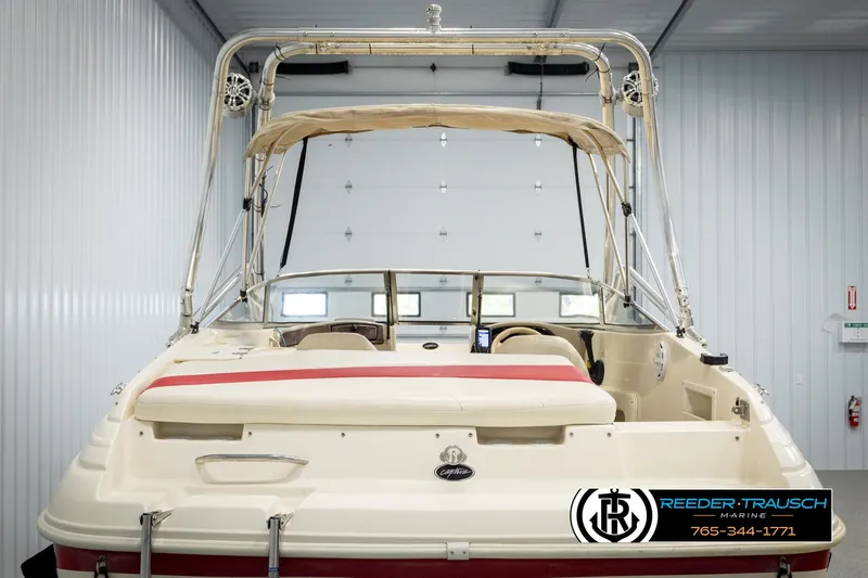 Slide: The Image of 2002 Rinker 192 Captiva boat in storage, rear view with canopy and seating. - 7