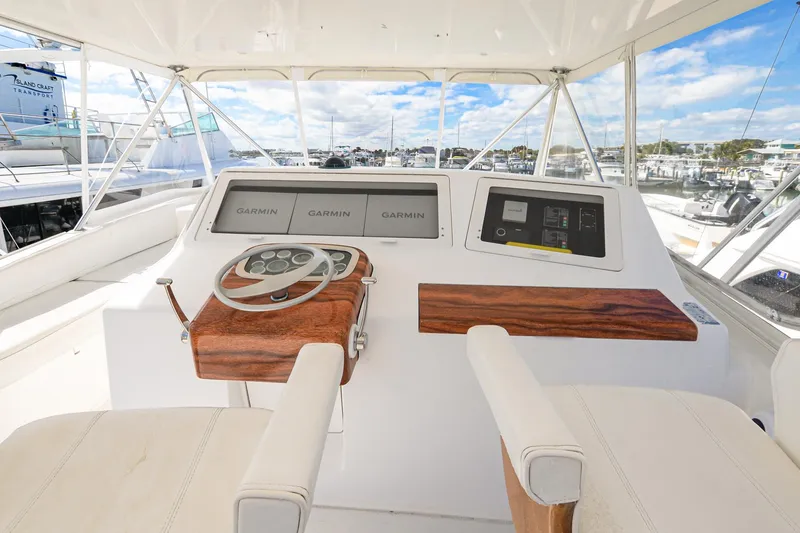 Slide: The Image of Helm of 1999 Viking 55 Convertible yacht with modern navigation equipment. - 15