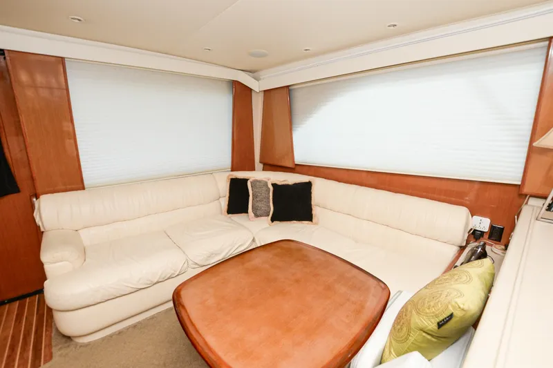Slide: The Image of Luxurious interior of 1999 Viking 55 Convertible yacht with cream leather seating. - 36