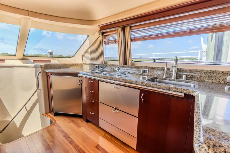 Slide: The Image of Luxurious kitchen interior of 2005 Sea Ray 550 Sedan Bridge yacht with modern appliances. - 14