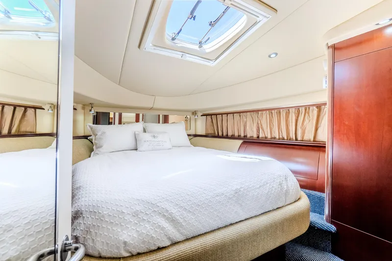 Slide: The Image of Luxurious bedroom interior of 2005 Sea Ray 550 Sedan Bridge yacht with skylight. - 17