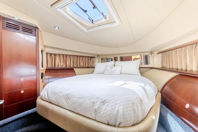 Slide: The Image of Luxurious bedroom interior of 2005 Sea Ray 550 Sedan Bridge yacht with skylight. - 19