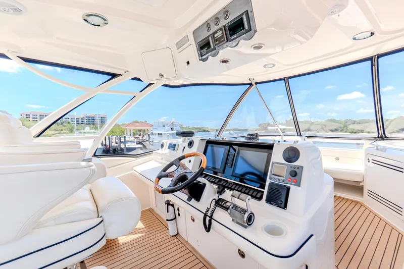 Slide: The Image of Luxurious 2005 Sea Ray 550 Sedan Bridge yacht interior with modern navigation equipment. - 38