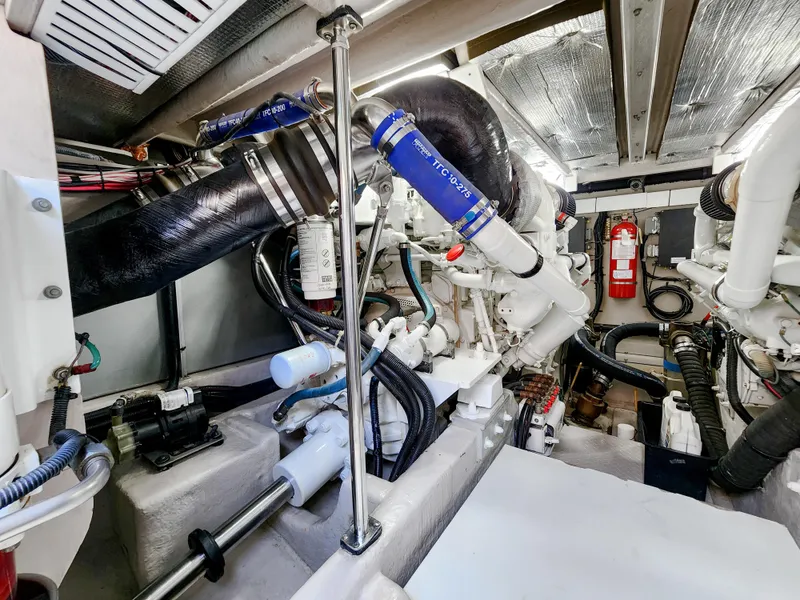Slide: The Image of Engine room of a 2005 Sea Ray 550 Sedan Bridge yacht, showcasing mechanical components. - 43