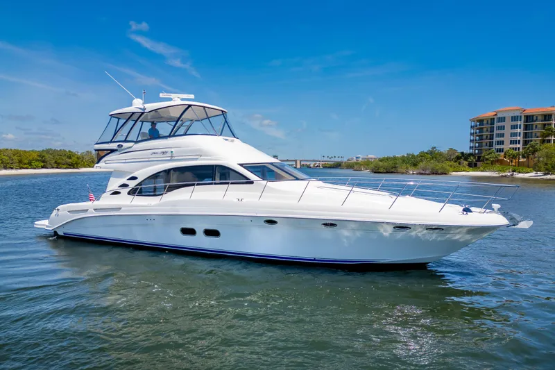 Slide: The Image of 2005 Sea Ray 550 Sedan Bridge yacht cruising on a sunny day. - 46