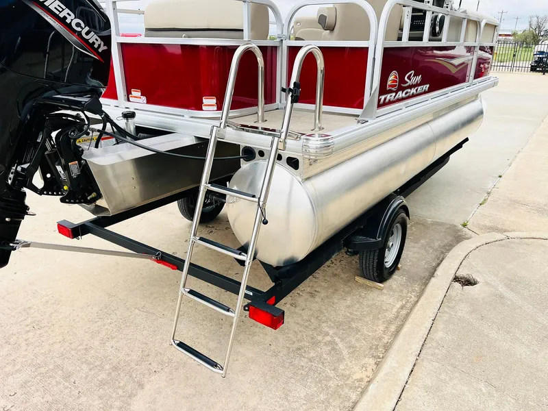 Slide: The Image of 2025 Sun Tracker Party Barge 18 DLX pontoon boat with ladder and Mercury engine. - 10