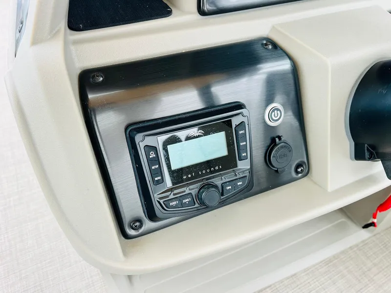 Slide: The Image of 2025 Sun Tracker Party Barge 18 DLX dashboard with control panel and display. - 29