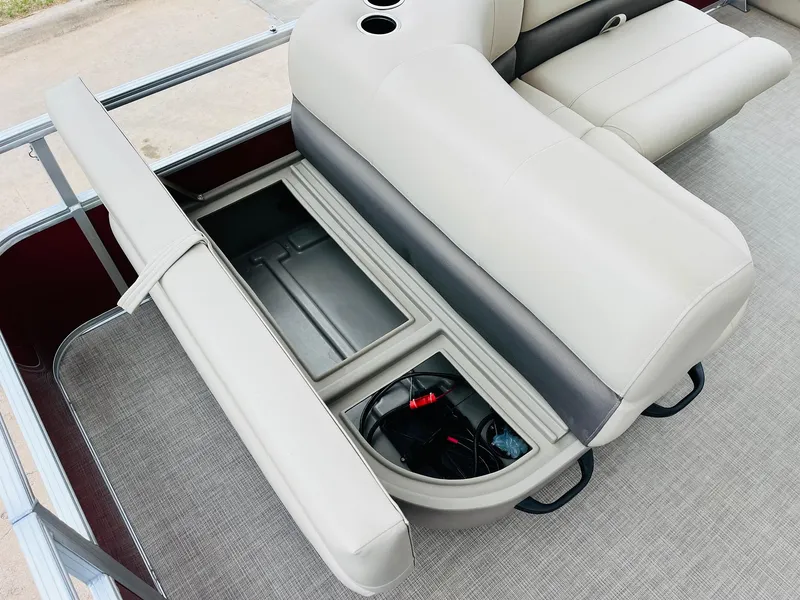 Slide: The Image of 2025 Sun Tracker Party Barge 18 DLX pontoon boat with open storage compartment. - 36