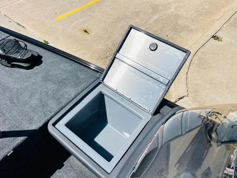 Slide: The Image of Open storage compartment on 2025 Tracker Bass Tracker Classic XL boat. - 11