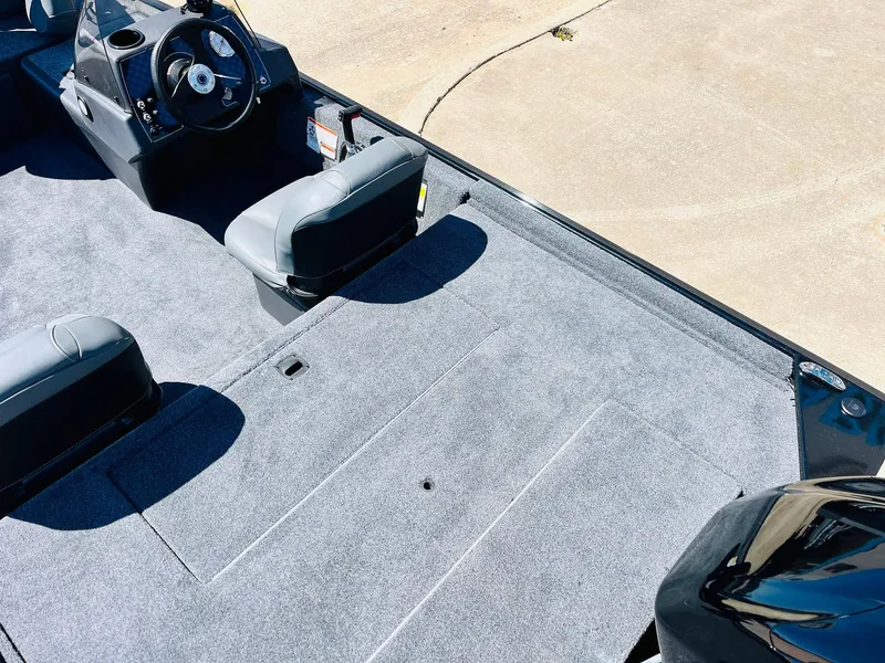 Slide: The Image of 2025 Tracker Bass Tracker Classic XL boat interior with gray carpet and seating. - 23