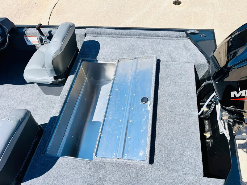 Slide: The Image of 2025 Tracker Bass Tracker Classic XL boat interior with seating and storage compartment. - 25