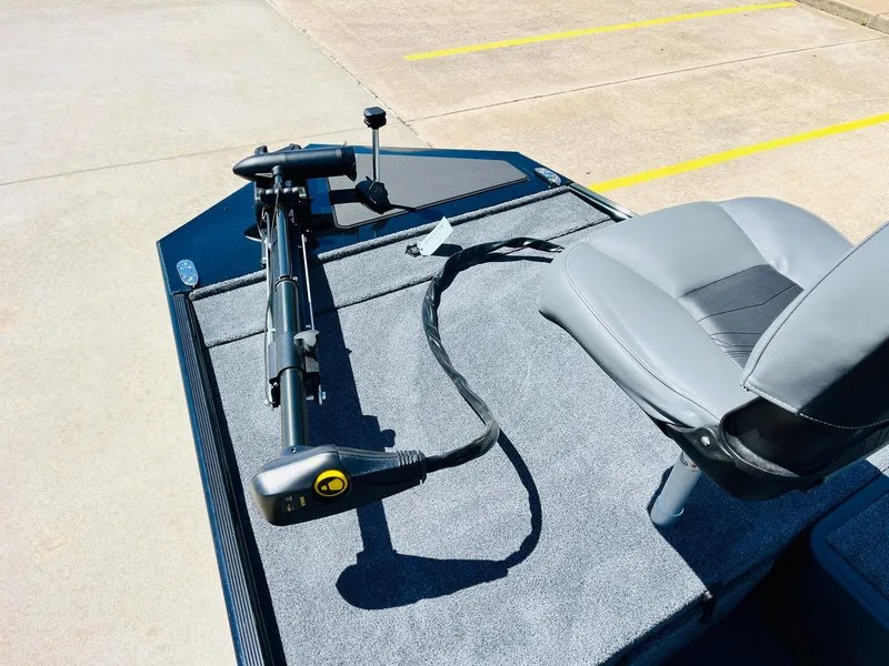 Slide: The Image of 2025 Tracker Bass Tracker Classic XL boat deck with seat and trolling motor. - 6