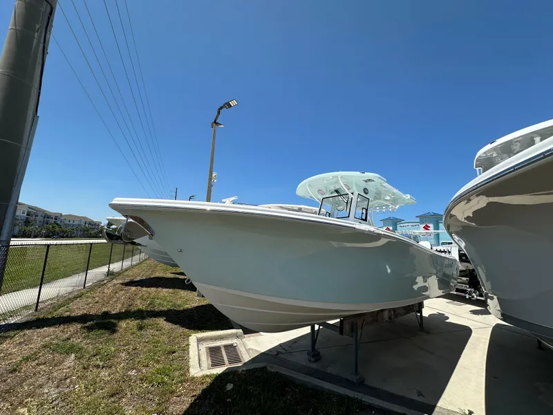 The Image of 2025 Sea Pro 292 Offshore boat displayed outdoors under clear blue sky. - 1