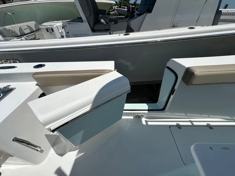Slide: The Image of 2025 Sea Pro 292 Offshore boat interior with seating and storage compartments. - 15