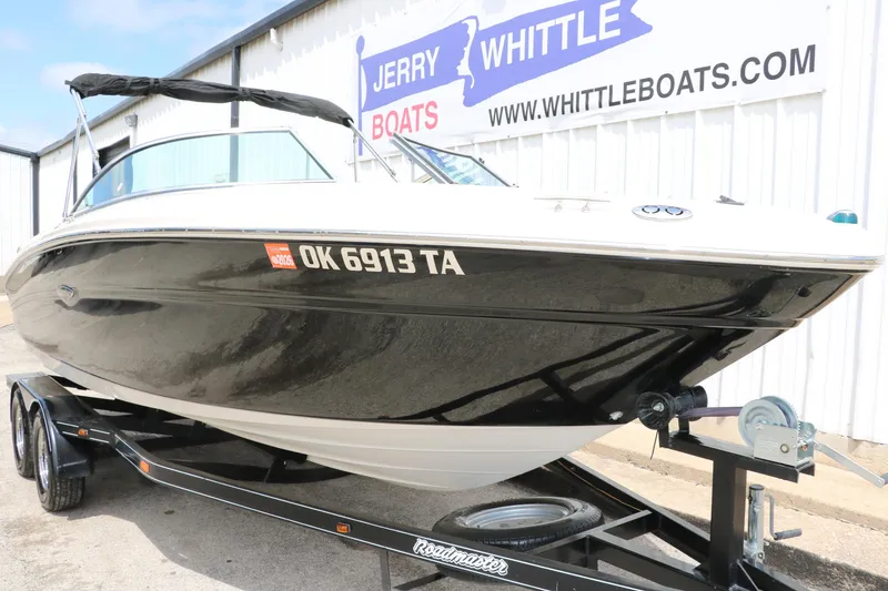 Slide: The Image of 2004 Sea Ray 220 Select boat on trailer at Jerry Whittle Boats dealership. - 12