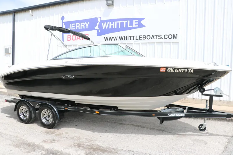 Slide: The Image of 2004 Sea Ray 220 Select boat on trailer at Jerry Whittle Boats dealership. - 14