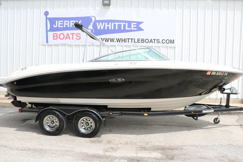 Slide: The Image of 2004 Sea Ray 220 Select boat on trailer, displayed at Jerry Whittle Boats dealership. - 15