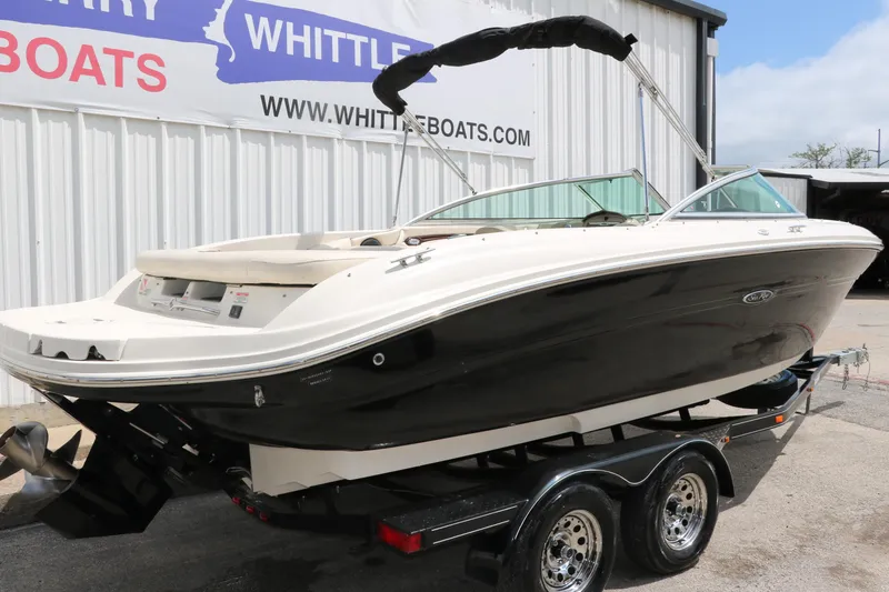 Slide: The Image of 2004 Sea Ray 220 Select boat on trailer at Whittle Boats dealership. - 3