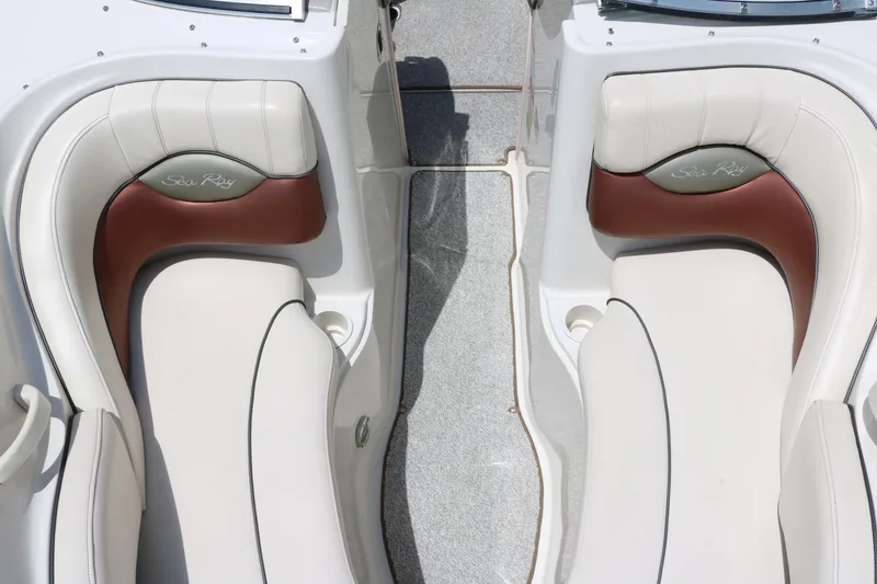 Slide: The Image of 2004 Sea Ray 220 Select boat interior with beige and brown seating. - 34
