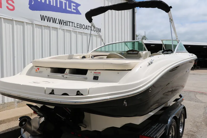Slide: The Image of 2004 Sea Ray 220 Select boat on trailer at Whittle Boats dealership. - 4