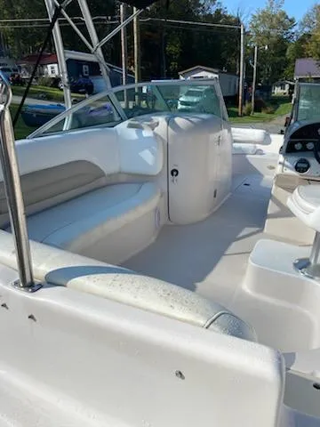 Slide: The Image of 2002 Hurricane 217 Sundeck boat interior with white seating and control panel. - 3