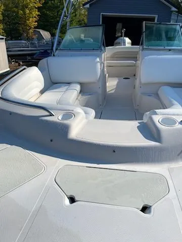 Slide: The Image of 2002 Hurricane 217 Sundeck boat with white seating and open deck layout. - 9