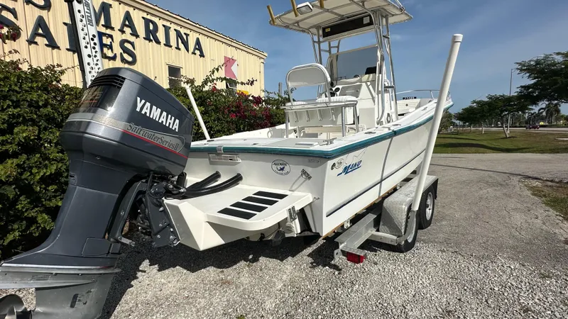 Slide: The Image of 1998 Mako 232 Center Console boat with Yamaha outboard motor on trailer. - 10