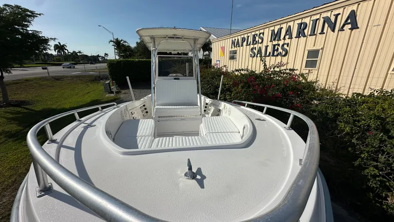 Slide: The Image of 1998 Mako 232 Center Console boat at Naples Marina Sales, sunny day view. - 2