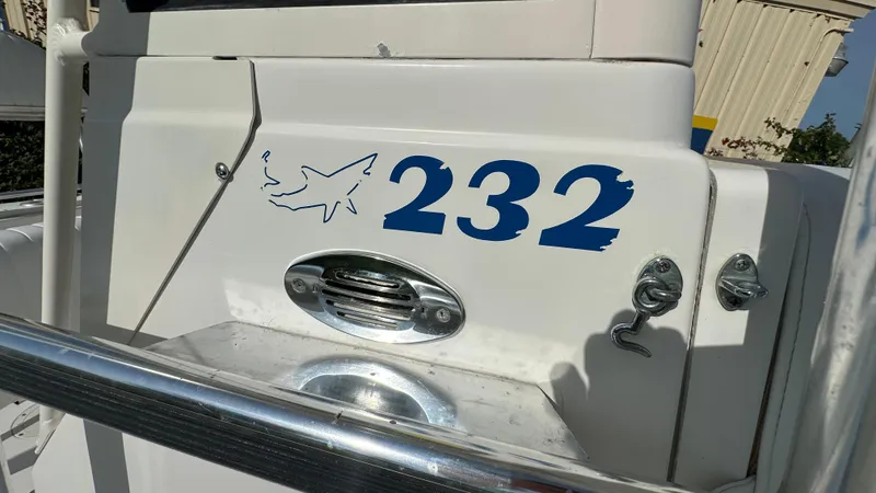 Slide: The Image of 1998 Mako 232 Center Console boat with shark logo and blue numbers. - 4
