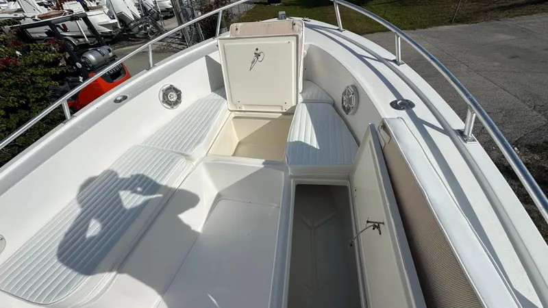 Slide: The Image of 1998 Mako 232 Center Console boat interior with open storage compartments. - 5