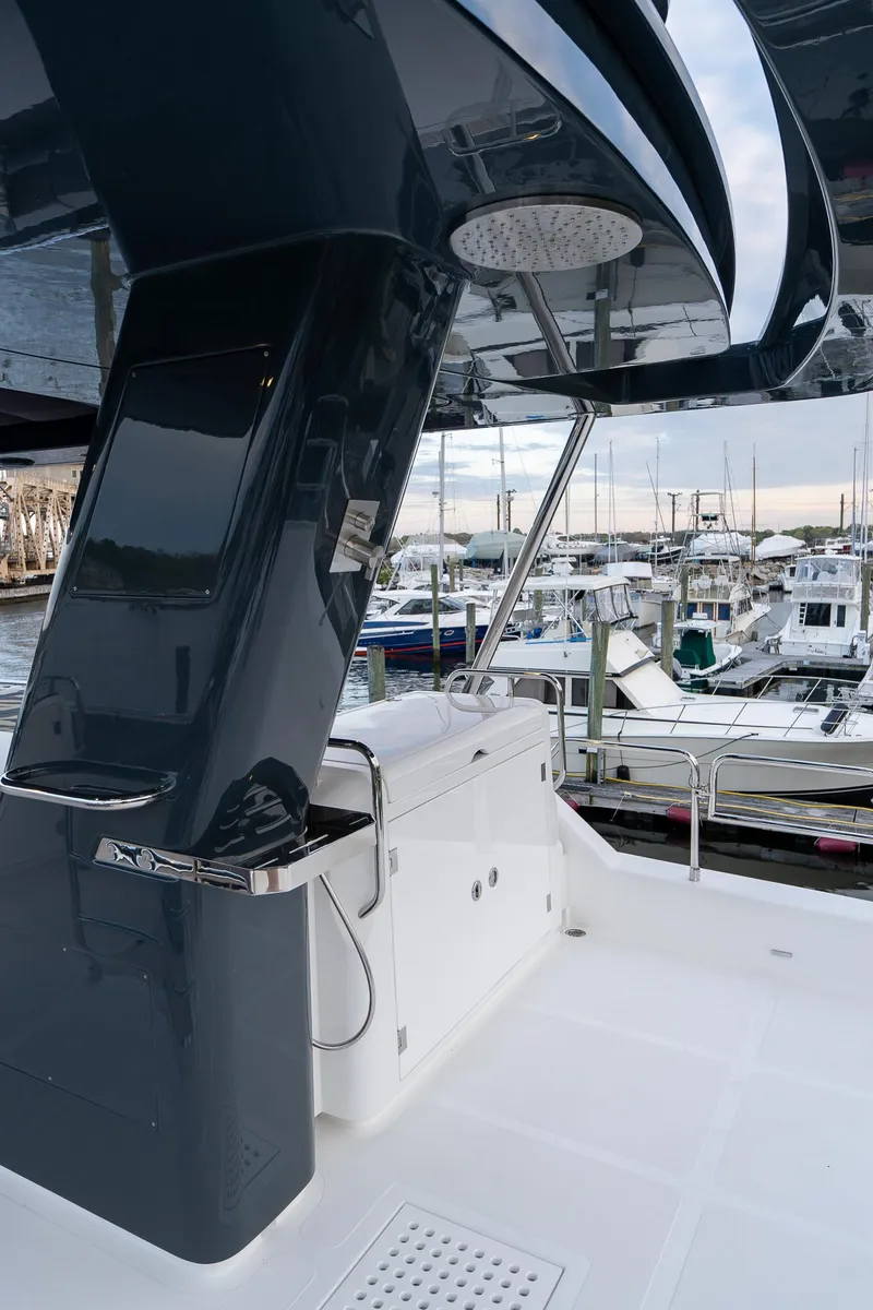 Slide: The Image of 2024 Sirena 58 Flybridge yacht docked at marina, showcasing sleek design and modern features. - 24