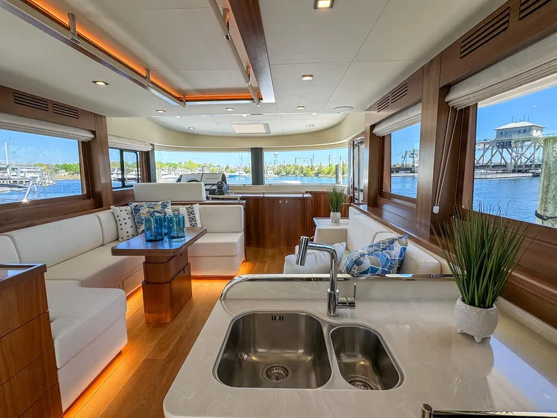 Slide: The Image of Luxurious interior of 2024 Sirena 58 Flybridge yacht with modern design and scenic views. - 40