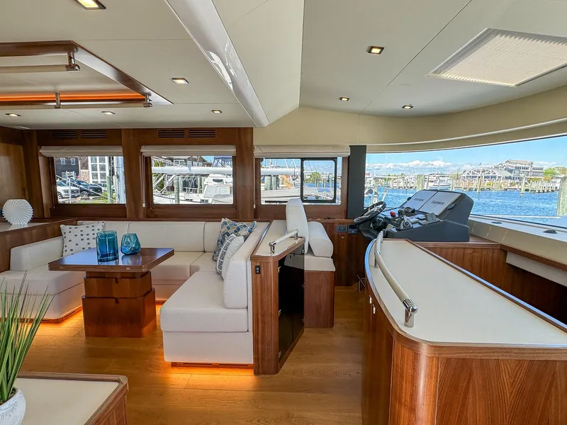 Slide: The Image of Luxurious interior of 2024 Sirena 58 Flybridge yacht with elegant seating and scenic views. - 45