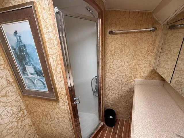 Slide: The Image of Luxurious bathroom in 2007 Jersey Cape 44 CNV yacht with shower and elegant decor. - 16