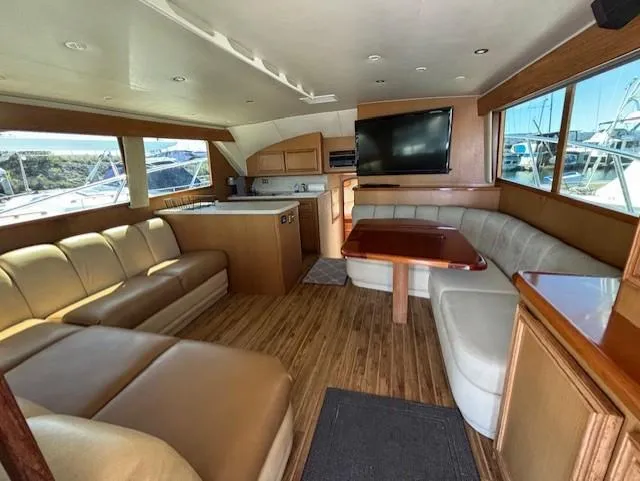 Slide: The Image of Luxurious 2007 Jersey Cape 44 CNV yacht interior with leather seating and modern amenities. - 2