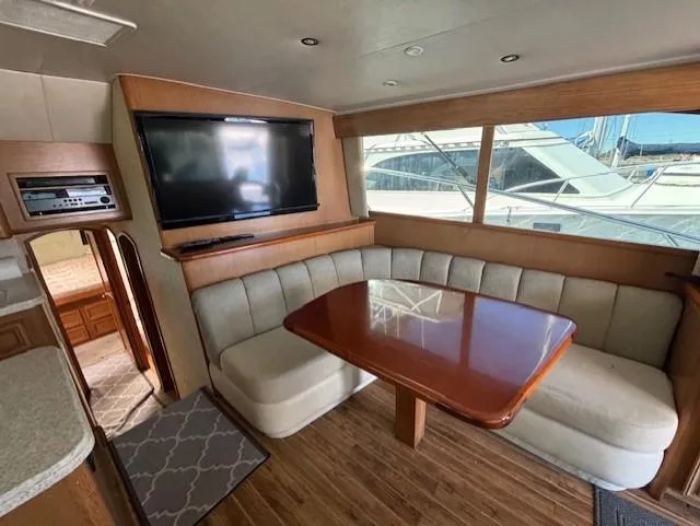 Slide: The Image of Interior of 2007 Jersey Cape 44 CNV yacht with dining area and TV. - 26